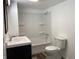 Modern bathroom featuring a vanity with sink, toilet, and shower/tub with white surround at 2712 S A St, Elwood, IN 46036
