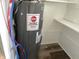 Utility area featuring a Richmond water heater, ensuring a consistent hot water supply at 2712 S A St, Elwood, IN 46036