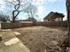 Large backyard with wood fence, offering plenty of space for outdoor activities and gardening at 2821 E 13Th St, Indianapolis, IN 46201
