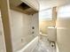 Clean and functional bathroom featuring a shower/tub combo, vanity, and tiled flooring at 2821 E 13Th St, Indianapolis, IN 46201