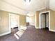 Comfortable bedroom with neutral walls, carpet flooring and windows, providing a bright and welcoming space at 2821 E 13Th St, Indianapolis, IN 46201