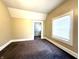 Comfortable bedroom with neutral walls, carpet flooring and windows, providing a bright and welcoming space at 2821 E 13Th St, Indianapolis, IN 46201