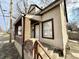 Charming home featuring brick accents, stairs leading to the front door, and a cozy covered porch at 2821 E 13Th St, Indianapolis, IN 46201
