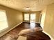 Inviting living room featuring hardwood floors and natural light streaming through large windows at 2821 E 13Th St, Indianapolis, IN 46201