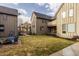 Exterior view of homes with backyard lawn, patio and firepit at 304 E 17Th St, Indianapolis, IN 46202
