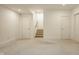 Large finished basement with neutral carpet, offering versatile space for living or recreation at 304 E 17Th St, Indianapolis, IN 46202