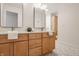 Bright bathroom featuring double sinks, modern fixtures, and plenty of storage space at 304 E 17Th St, Indianapolis, IN 46202