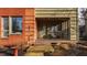 Cozy front porch with seating and classic brick facade, perfect for relaxing and enjoying the outdoors at 304 E 17Th St, Indianapolis, IN 46202