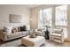 Bright living room with ample seating, stylish decor, and an abundance of natural light at 304 E 17Th St, Indianapolis, IN 46202