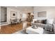 Open-concept living area with hardwood floors, modern decor, and abundant natural light at 304 E 17Th St, Indianapolis, IN 46202