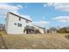 Spacious backyard featuring a lush lawn and direct access to a serene pond, blending nature with home at 3155 N White River Pkwy E Dr, Indianapolis, IN 46208