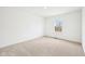 Well-lit bedroom with neutral walls and carpet, offering a clean and spacious feel at 3155 N White River Pkwy E Dr, Indianapolis, IN 46208