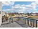 Enjoy serene views from the deck overlooking the picturesque pond and neighborhood homes at 3155 N White River Pkwy E Dr, Indianapolis, IN 46208
