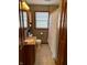Cozy bathroom featuring a sink with a granite countertop and a tub with a curtain at 316 Elm St, Greenwood, IN 46142