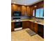 A cozy kitchen showcasing wooden cabinets, laminate countertops, and modern appliances at 316 Elm St, Greenwood, IN 46142