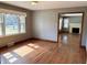 Bright living room featuring hardwood floors and a view into another living area at 316 Elm St, Greenwood, IN 46142
