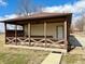 Outdoor patio featuring wooden beams, a bench, and a view of the yard at 316 Elm St, Greenwood, IN 46142