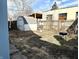 A fenced backyard features an old shed and outdoor grill at 3426 W Michigan St, Indianapolis, IN 46222