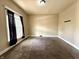 Cozy bedroom with neutral walls, plush carpeting, and a bright window at 3426 W Michigan St, Indianapolis, IN 46222
