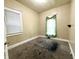 A cozy bedroom features a window with blinds and neutral wall color at 3426 W Michigan St, Indianapolis, IN 46222