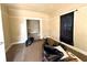 Cozy bedroom with neutral walls, plush carpeting, and access to the other rooms at 3426 W Michigan St, Indianapolis, IN 46222