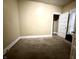 Neutral bedroom with soft carpeting and access to an adjacent room at 3426 W Michigan St, Indianapolis, IN 46222