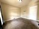 Cozy bedroom with neutral walls, plush carpeting, and a bright window at 3426 W Michigan St, Indianapolis, IN 46222
