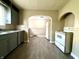 A functional kitchen with gray cabinets and modern appliances at 3426 W Michigan St, Indianapolis, IN 46222