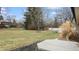 Spacious backyard with a wooden deck, mature trees, and a grassy lawn at 3779 W County Line Rd, Greenwood, IN 46142