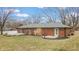 Spacious backyard featuring a well-maintained lawn, mature trees, and two wooden decks for outdoor living at 3779 W County Line Rd, Greenwood, IN 46142