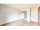 Bright bedroom with neutral carpet and a closet with sliding mirrored doors at 3779 W County Line Rd, Greenwood, IN 46142