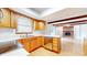 Functional kitchen with wooden cabinets, a double basin sink, and modern appliances at 3779 W County Line Rd, Greenwood, IN 46142
