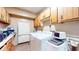 Functional laundry room with washer, dryer, cabinets, and ample storage space at 3779 W County Line Rd, Greenwood, IN 46142