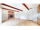 Spacious living room featuring a brick fireplace, hardwood floors, and white trim at 3779 W County Line Rd, Greenwood, IN 46142