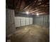 An empty garage with a white door and concrete floor shows open space at 3851 N Campbell Ave, Indianapolis, IN 46226