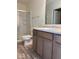 Bathroom featuring a wood vanity, large mirror, toilet and step-in shower with glass doors at 3885 Berkdale Ct, Columbus, IN 47203