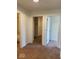 Hallway showing access to the bathroom and two bedrooms, all with carpet or vinyl floors at 3885 Berkdale Ct, Columbus, IN 47203