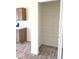 A walk-in pantry with white wire shelving and light wood-look floors, accessible from the kitchen at 3885 Berkdale Ct, Columbus, IN 47203