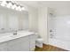 Bright bathroom featuring a white vanity, large mirror, and a bathtub at 3913 Wren Dr, Brownsburg, IN 46112
