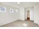 Bright bedroom featuring plush carpeting, natural light from multiple windows, and easy access to the bathroom at 3913 Wren Dr, Brownsburg, IN 46112