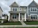 Charming two-story home with stone accents, covered porch, and manicured lawn at 3913 Wren Dr, Brownsburg, IN 46112
