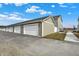 Row of garages with white doors, providing ample parking and storage space at 3913 Wren Dr, Brownsburg, IN 46112