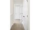 Hallway with white doors, neutral paint, and neutral carpet at 3913 Wren Dr, Brownsburg, IN 46112