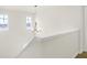 Hallway with a decorative chandelier, white trim, and neutral paint at 3913 Wren Dr, Brownsburg, IN 46112