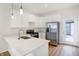 Modern kitchen featuring stainless steel appliances, white cabinetry, and an open layout at 3913 Wren Dr, Brownsburg, IN 46112