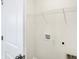 Conveniently located laundry area equipped with wire shelving and utility connections for washer and dryer at 3913 Wren Dr, Brownsburg, IN 46112