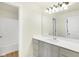 Bathroom featuring a bright vanity, a large mirror, and a shower-tub combination at 3959 Wren Dr, Brownsburg, IN 46112