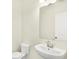 Bathroom featuring modern sink, toilet, and a large mirror at 3959 Wren Dr, Brownsburg, IN 46112