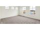 Spacious bedroom featuring neutral walls, plush carpet, and bright natural light from several windows at 3959 Wren Dr, Brownsburg, IN 46112