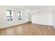 Bright living room with wood floors, staircase and large windows at 3959 Wren Dr, Brownsburg, IN 46112